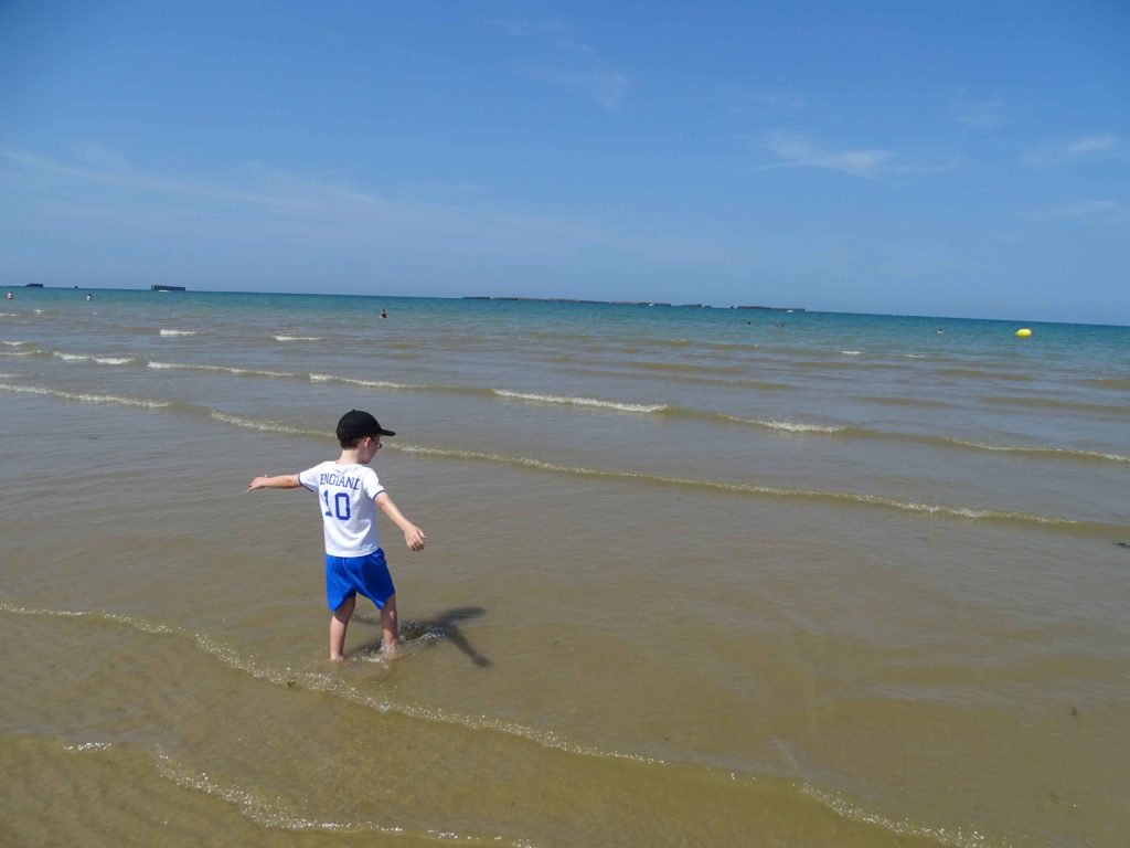 Playing on Arromanche Beach